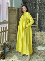 model wearing yellow button down dress by sowears