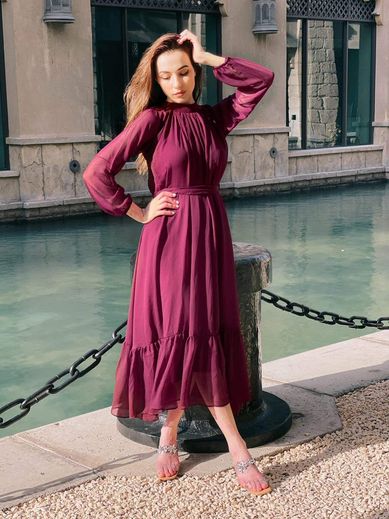 model wearing maroon maxi dress