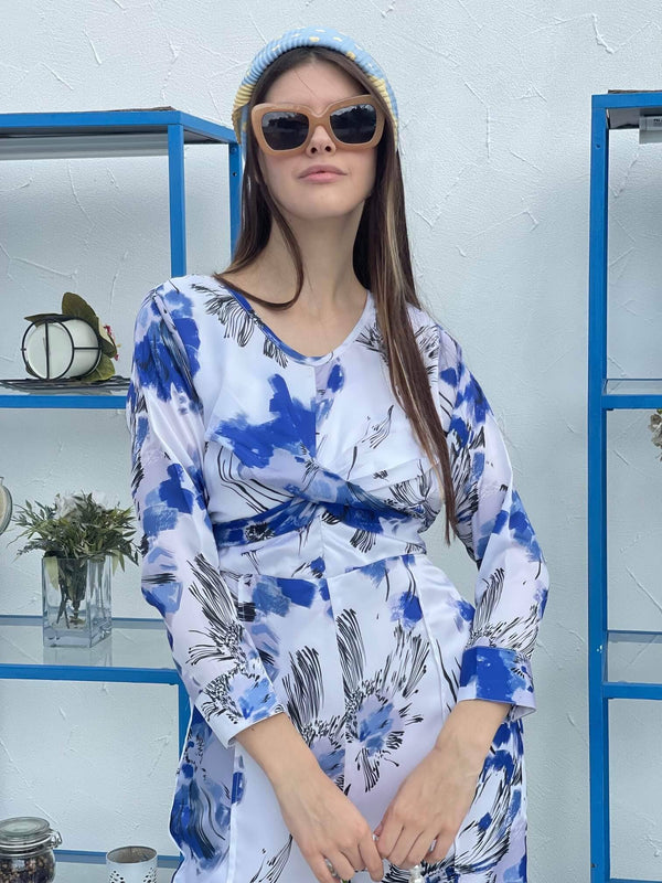 close up of a model wearing abstract blue and white floral jumpsuit