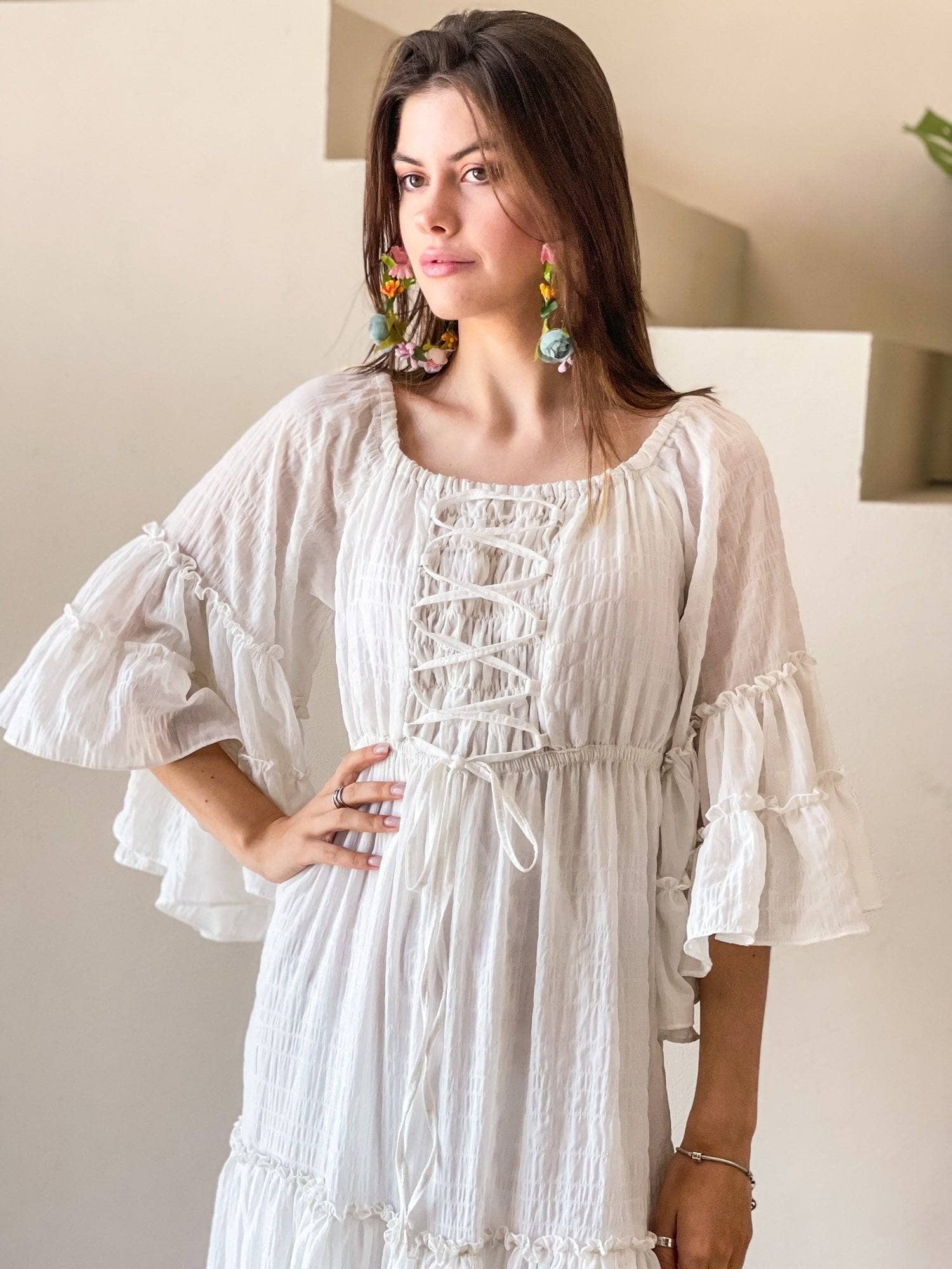model wearing off white maxi dress by sowears