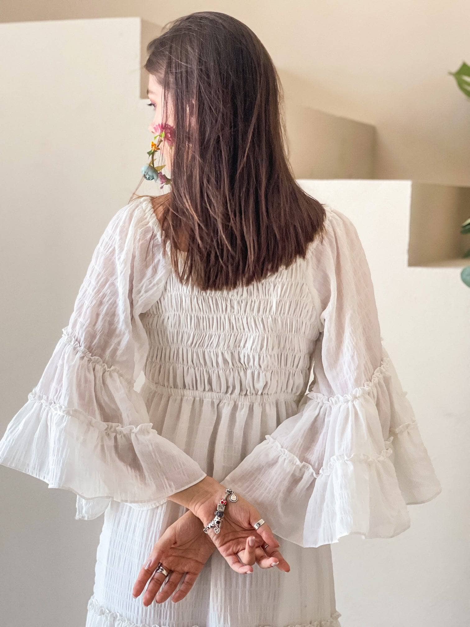back of model wearing off white maxi dress by sowears