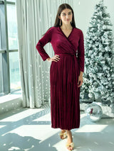model wearing plum velvet dress with long sleeves