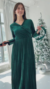 video of model wearing emerald green velvet long dress