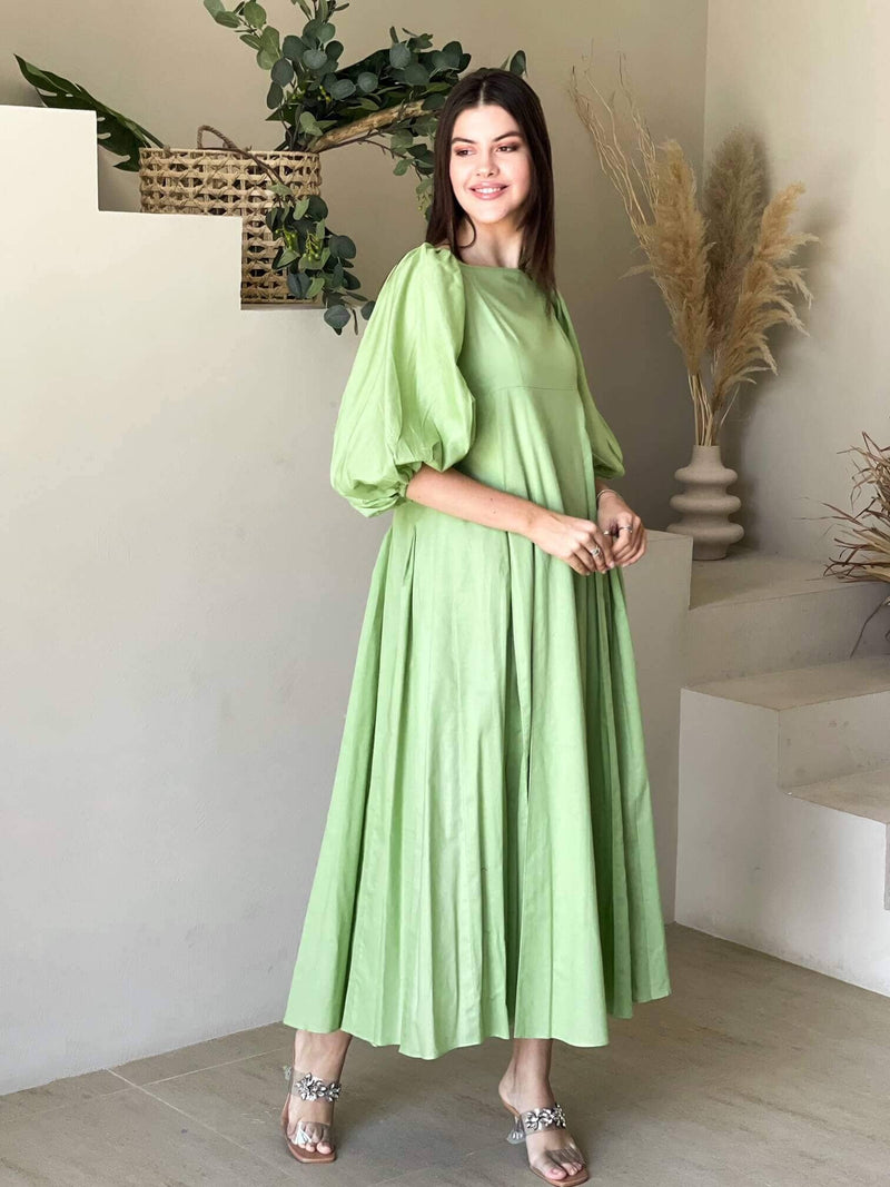 model showcasing pastel green dress