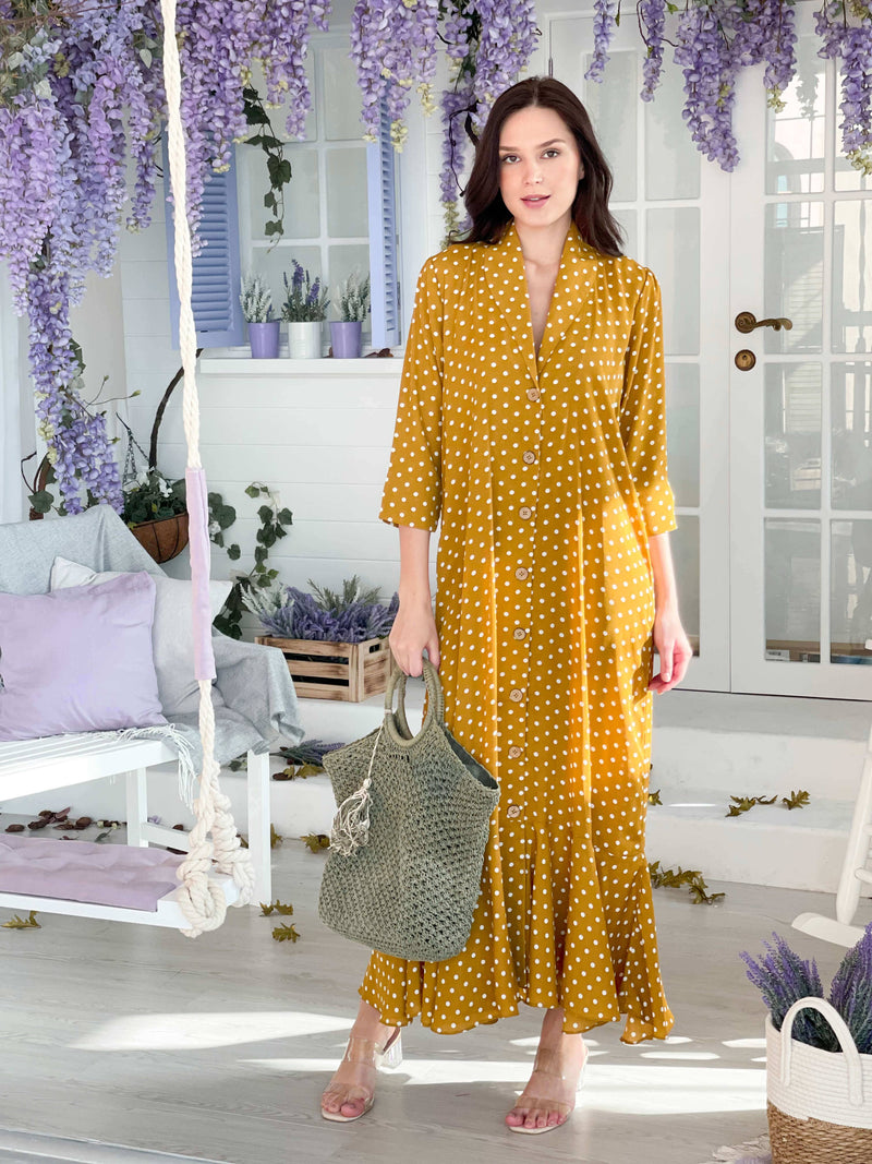 model posing with mustard polka dot dress by sowears
