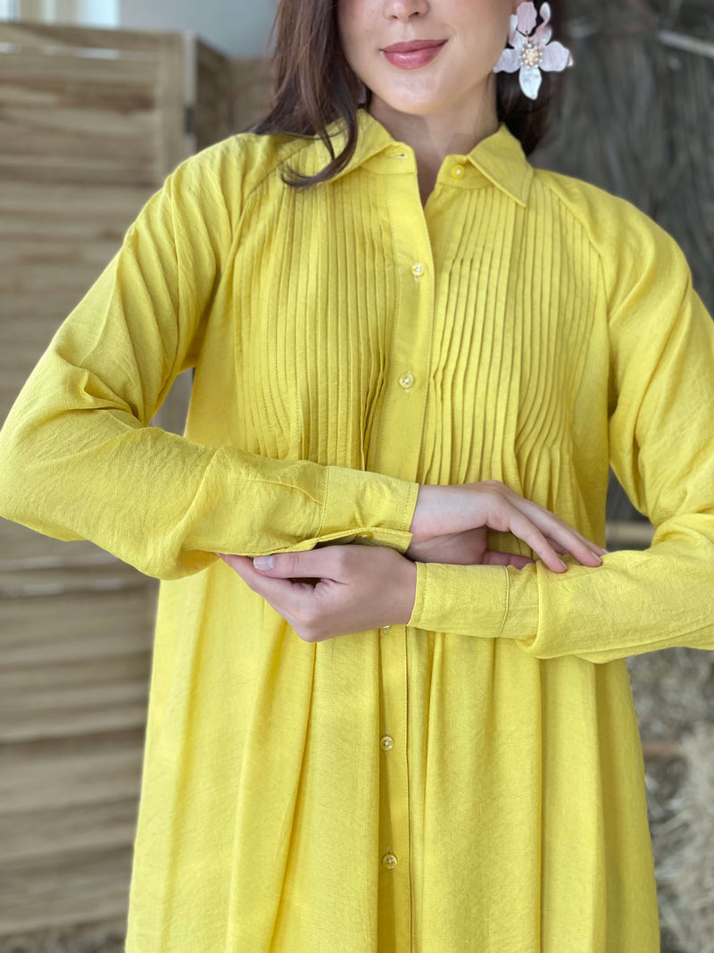 close up of yellow button down dress
