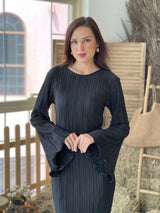 model wearing pleated long black bodycon dress by sowears