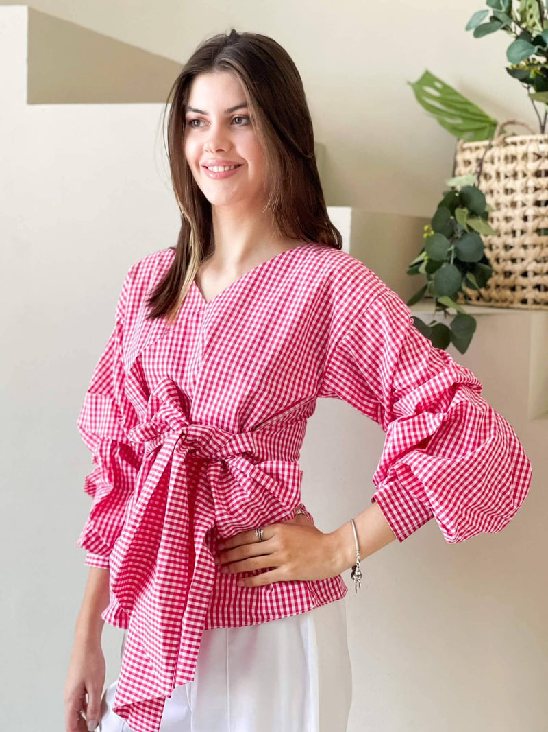 model in pink checkered shirt