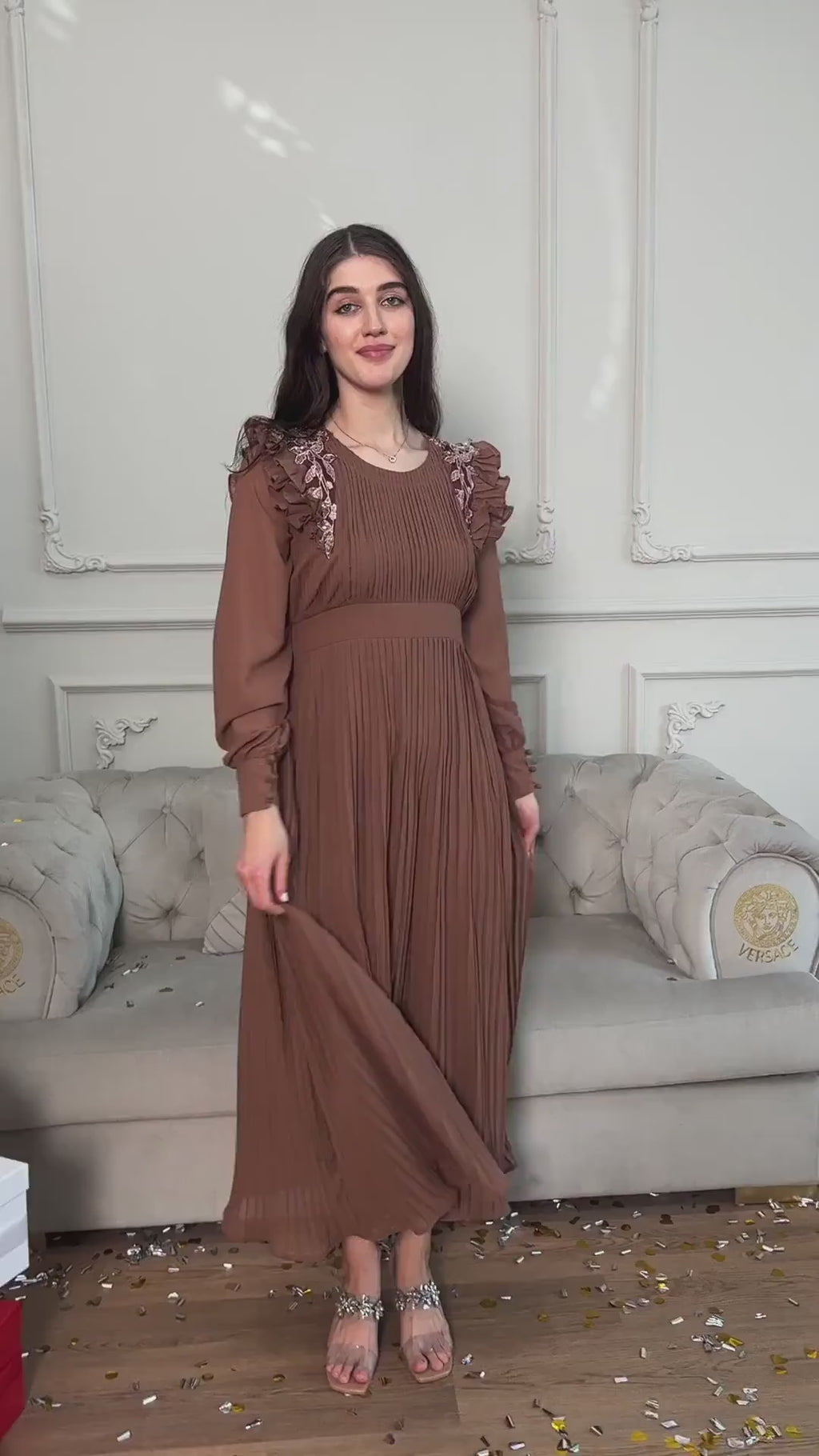 video of a model wearing brown pleated dress