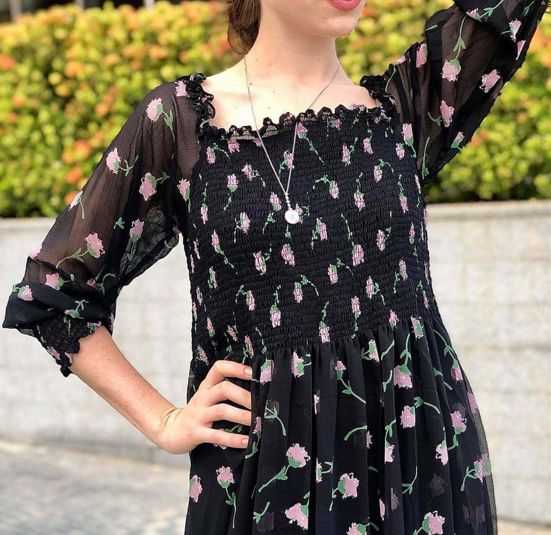 close up of sowears black floral smocked dress