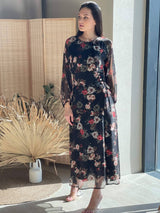model wearing elizabeth black floral dress by sowears