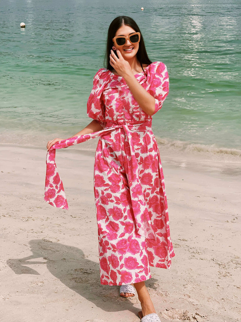 pink floral dress on the beach