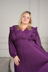 plus size model wearing purple pleated dress