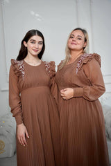 models posing with sowears brown pleated dress