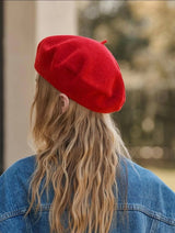 back of a model wearing the red beret cap by sowears